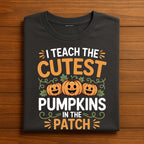 I Teach the Cutest Pumpkins Shirt, Gift Halloween Teacher Tee with Smiling Pumpkins and Vines