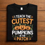 I Teach the Cutest Pumpkins Shirt, Gift Halloween Teacher Tee with Smiling Pumpkins and Vines, Sweatshirt Preschool Kindergarten Fall Top